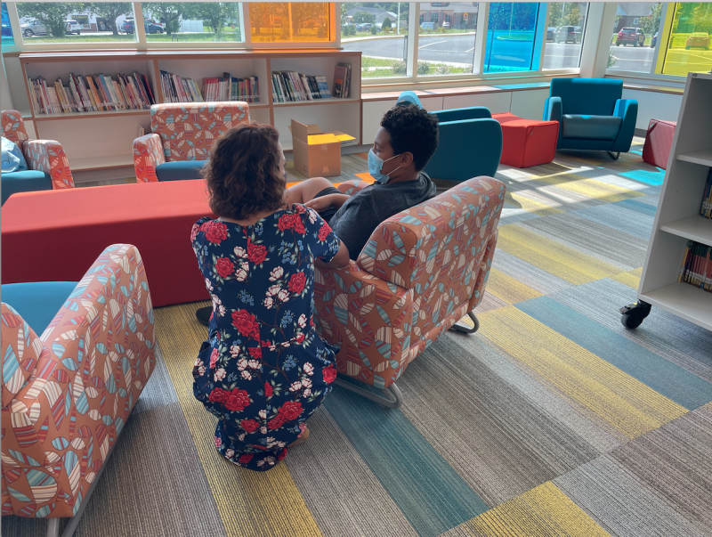 Board of Education President Alison Myers learns that Niikiai Jackson loves to read scary books and watch scary movies! SUBMITTED PHOTO